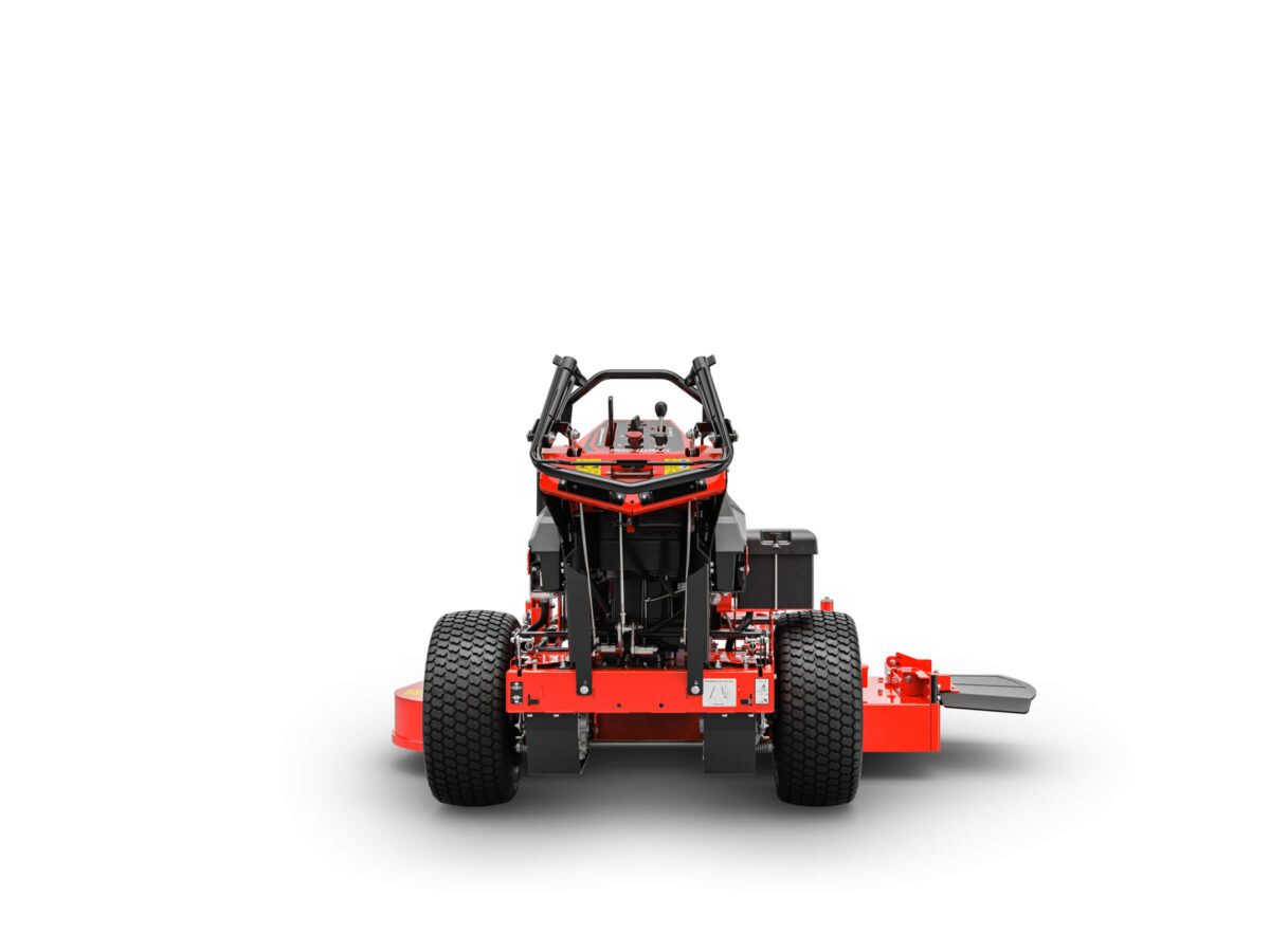 Front view of an orange and black stand-on lawn mower with large rear wheels and a metal foot platform on a white background.
