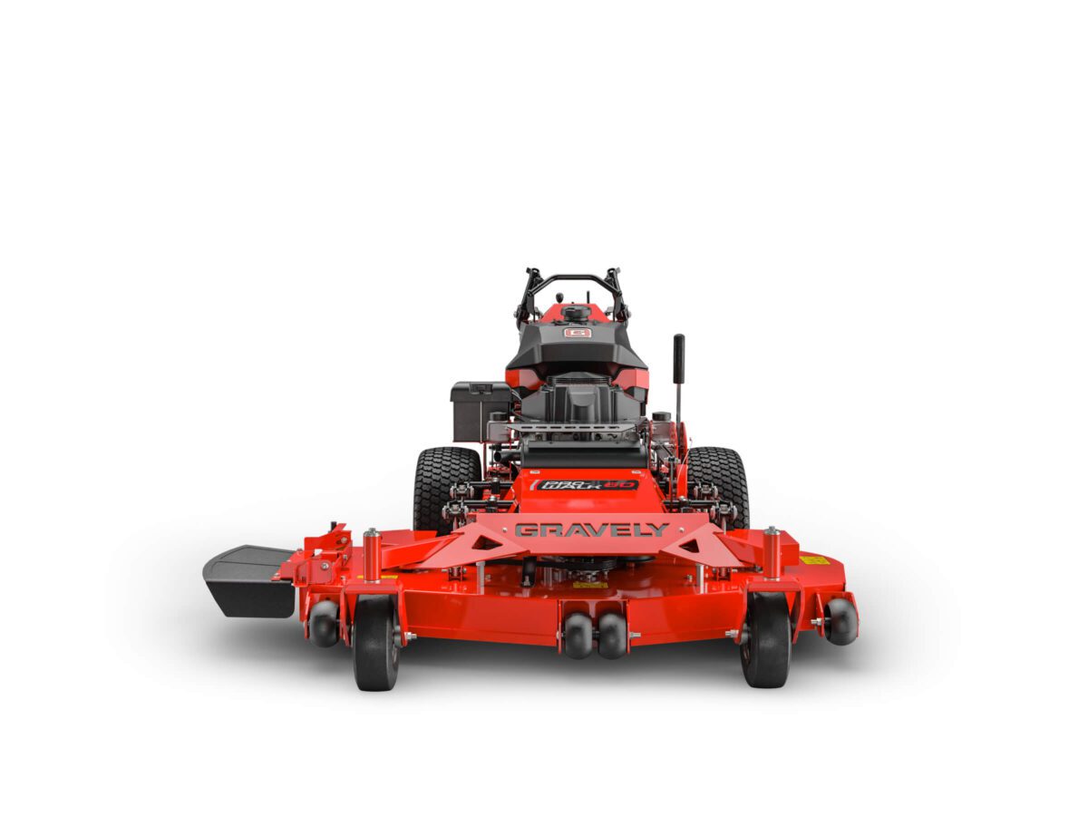 Red Gravely lawn mower with a wide cutting deck, black seat, and rear engine, viewed from the front against a plain white background.