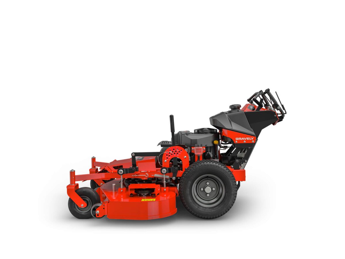 A red and black walk-behind lawn mower with a large cutting deck and wheels, viewed from the side against a white background.