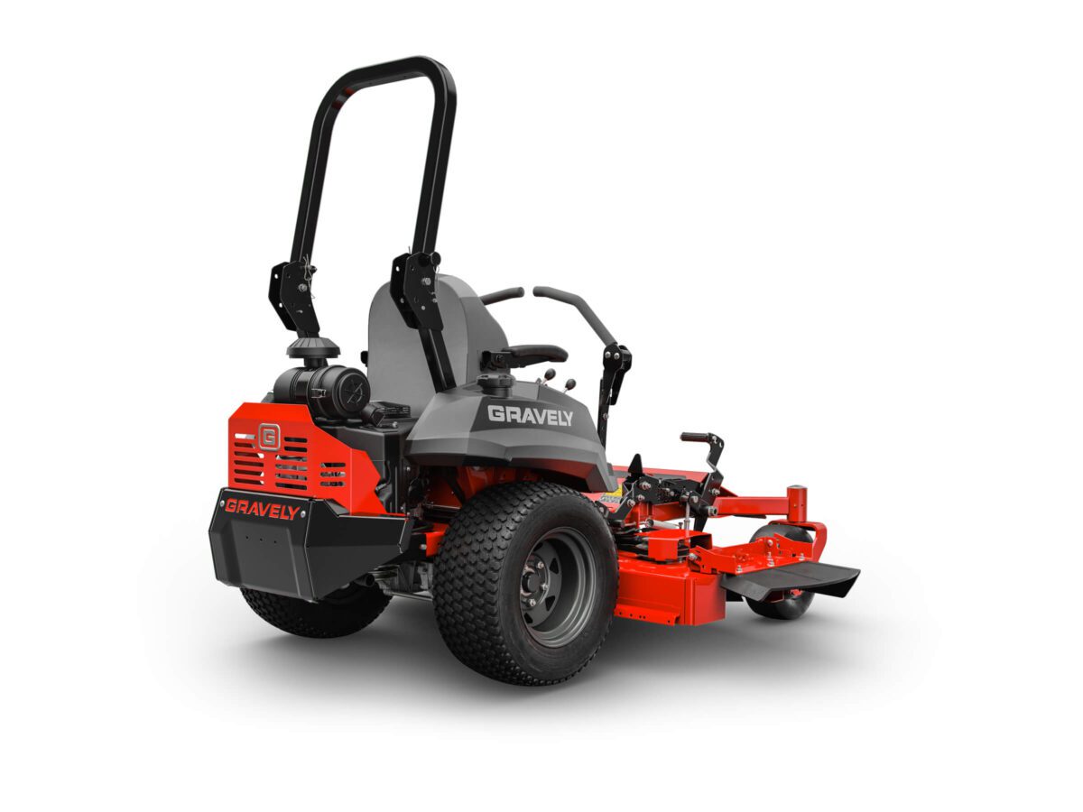 Red and gray Gravely zero-turn lawn mower with a wide cutting deck, seat with armrests, and rear engine.