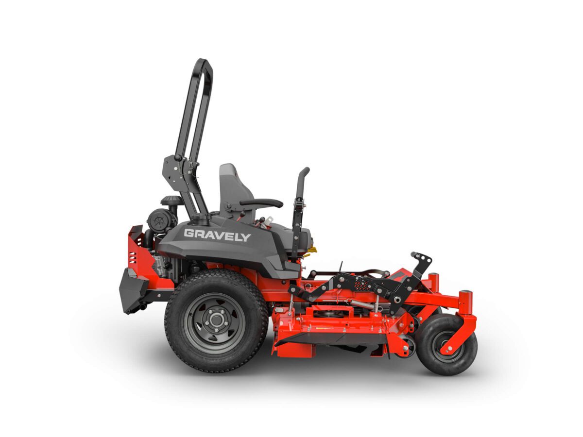 A red and black Gravely zero-turn lawn mower, featuring a seat, steering levers, and large rear wheels, viewed from the side.