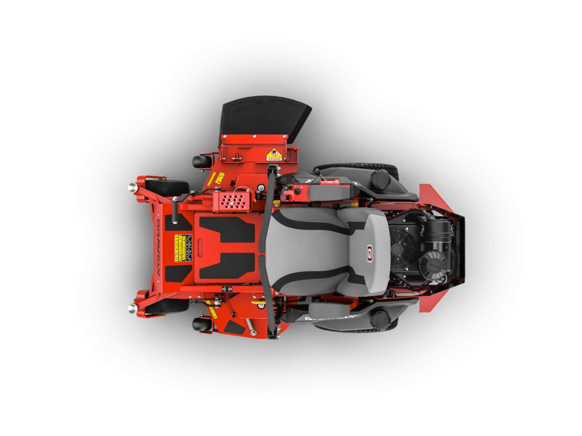 Top view of a red lawn mower with visible blades, wheels, and engine, set against a plain white background.