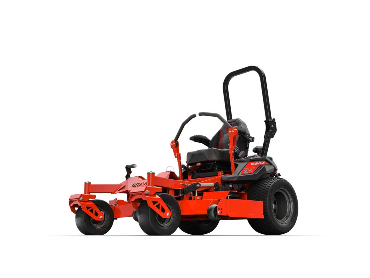 A red and black riding lawn mower with large rear wheels and a protective roll bar, designed for efficient grass cutting.