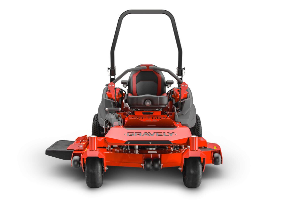 Red zero-turn lawn mower viewed from the front, with a black seat and steering controls. The brand name "Gravely" is visible on the mower's deck.