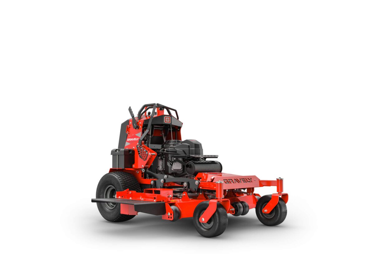A bright orange commercial-grade stand-on lawn mower with large rear wheels, featuring an elevated seat and controls.