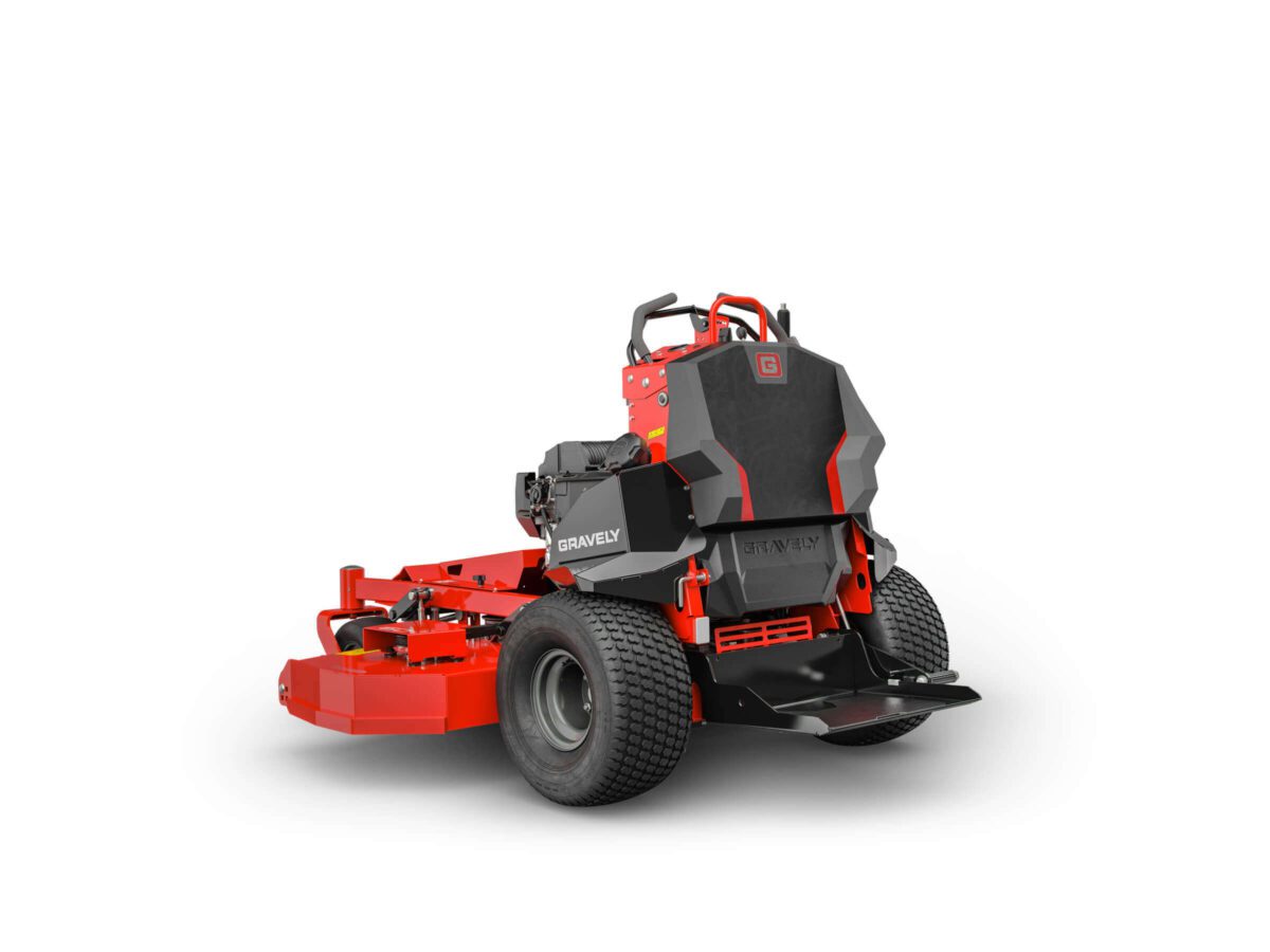 Red and black Gravely stand-on lawn mower, rear view, showing wheels and handlebars, on a white background.