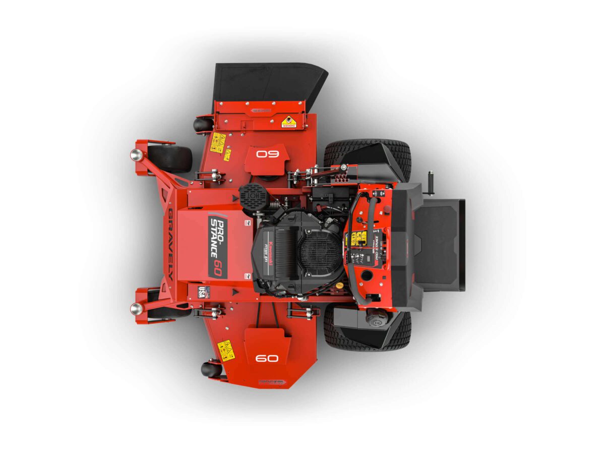 Top view of a red zero-turn lawn mower with visible engine and wheels, displaying a "SPARTAN" logo and the number "60" on the body.