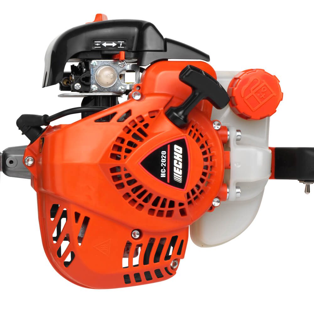 Close-up of an Echo engine, featuring a black top, orange casing, pull handle, and red cap on the side.