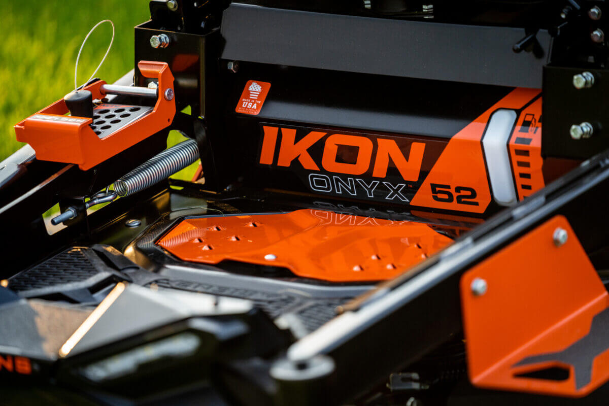 close up of IKON logo on mower